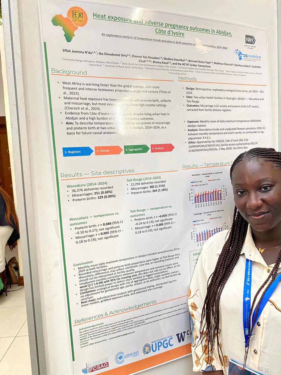 Effah Jemima N'da standing beside her poster, Heat exposure and adverse pregnancy outcomes in Abidjan, Cote d'Ivoire